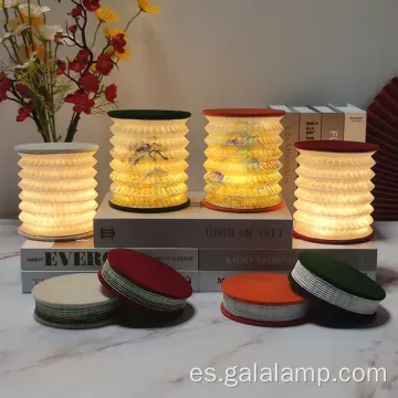 Luz nocturna elegante con diseño de libros plegables